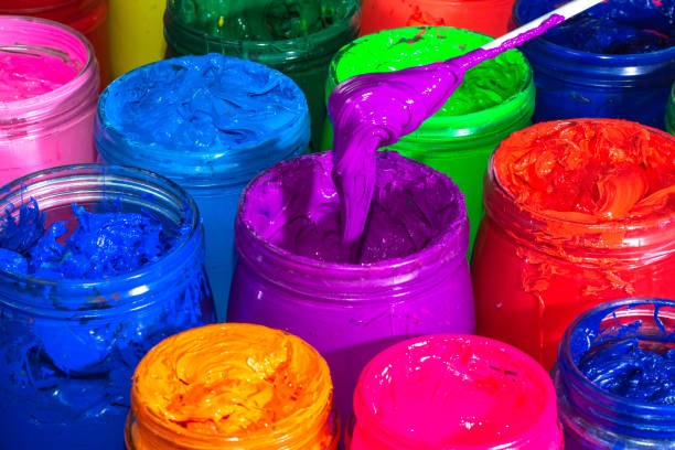 istock Use a spoon to scoop the purple paint 1319469222