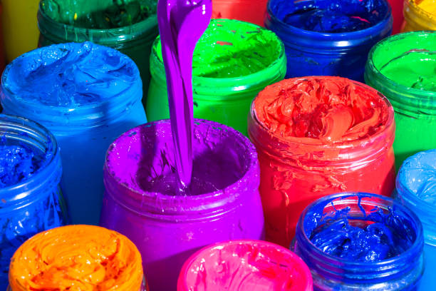 istock Use a spoon to scoop the purple paint 1319469240