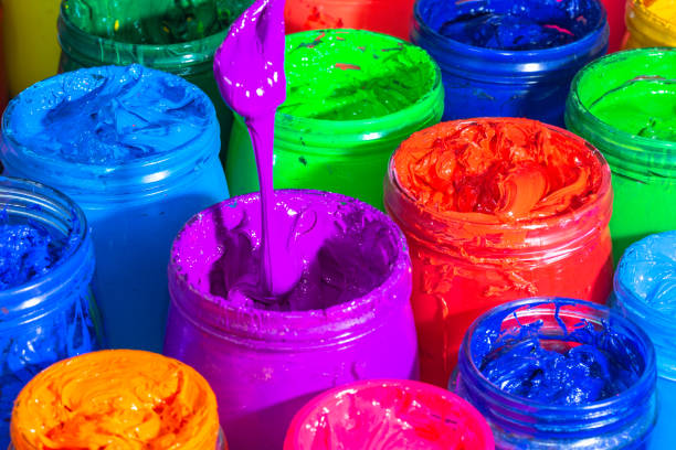 istock Use a spoon to scoop the purple paint 1319469252