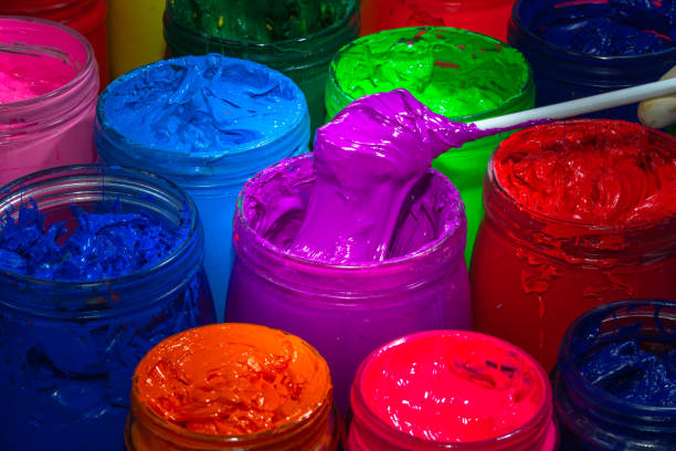 istock Use a spoon to scoop the purple paint 1319469253