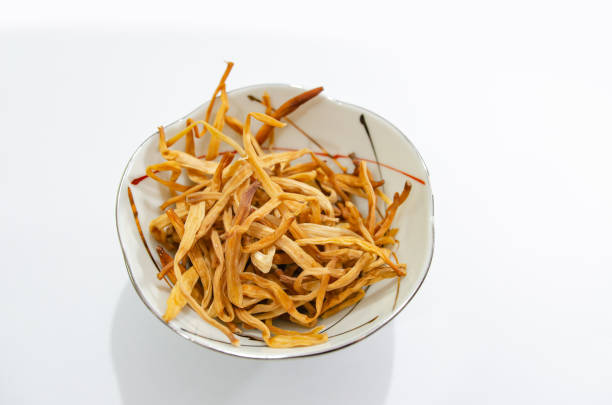 day lily in a Japanese style bowl on a white background