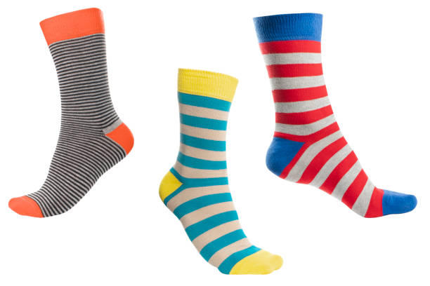 istock Three volumetric sock with different lines isolated on white background. Colorful volumetric socks son white background. Colored socks on the leg isolated on white background 1319469801