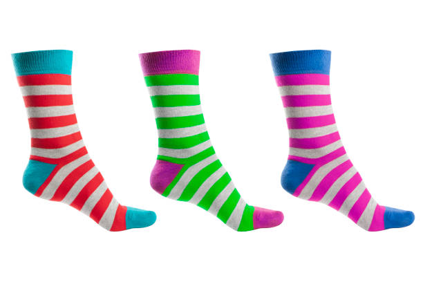 istock Three volumetric sock with different lines isolated on white background. Colorful volumetric socks on white background. Colored socks on the leg isolated on white background 1319470510