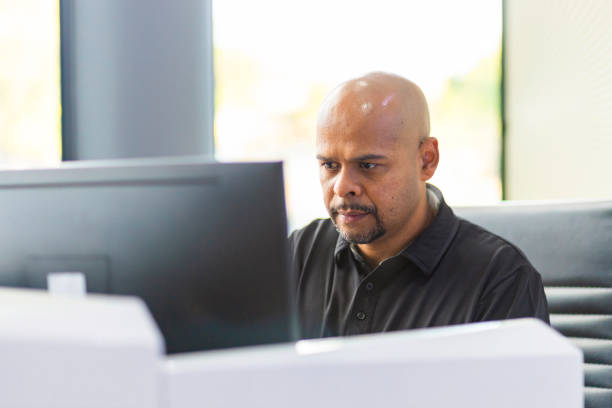 istock Businessman working at office front desk 1319470886