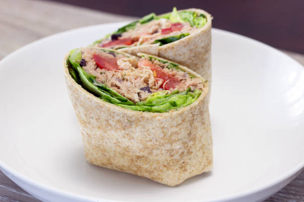 whole grain tuna mediterranean salad wrap quick healthy tuna salad wrap wrap sandwich photos stock pictures, royalty-free photos & images