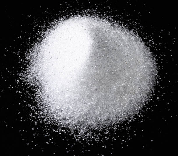 istock handful of crystalline erythritol on black 1319471130