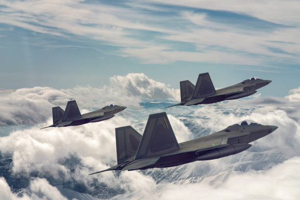 istock Jet fighters flying over the clouds. 1319471940