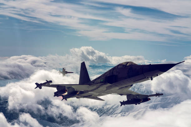 istock Jet fighters flying over the clouds. 1319472790