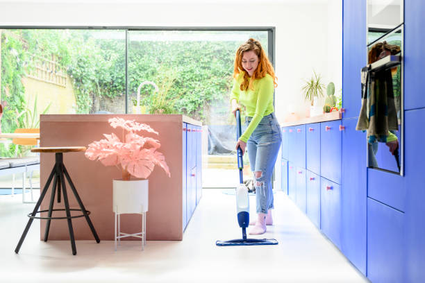 istock Mid 30s Caucasian woman doing housework on weekend 1319473964