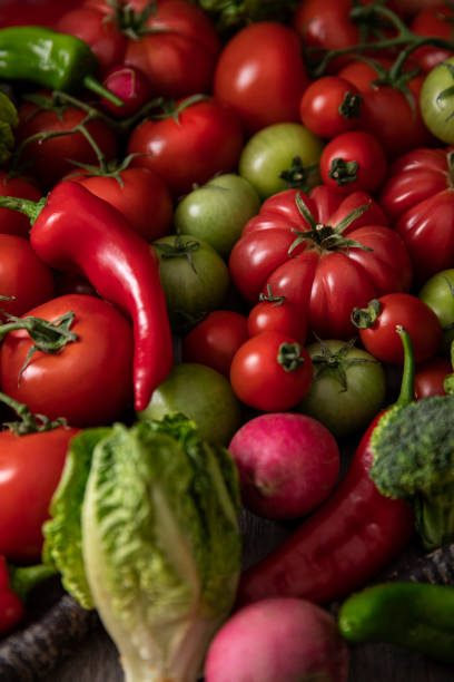 istock Green and Red Ripe Tomatoes with Vegetables 1319474667