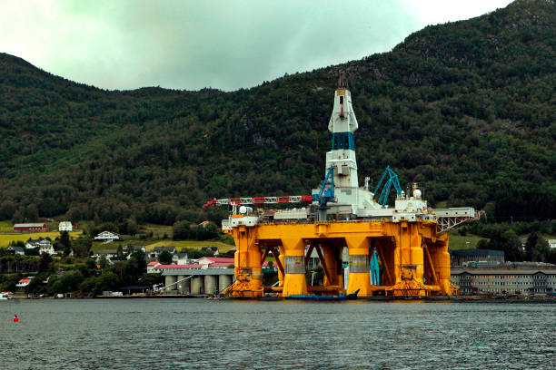 istock Large offshore oil rig drilling platform in Norway behind the mountains 1319474873