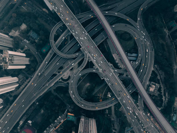 istock Aerial View of Complex Overpass and Busy Traffic 1319478201