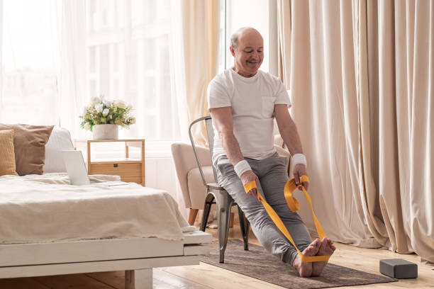 istock Man sitting on chair doing paschimottanasana or Intense Dorsal Stretch pose 1319478642
