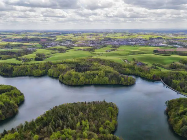 Photo of Aerial view of the Neyetalsperre (Neye Dam) in the Bergisches Land with a view of Wipperfürth in the background.