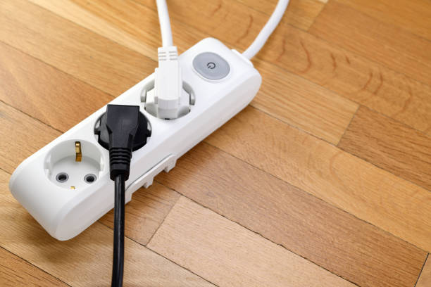 istock White extension cord with three outlets. Power strip with switch for home or office. 1319482966