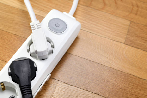 istock White extension cord with three outlets. Power strip with switch for home or office. 1319483033