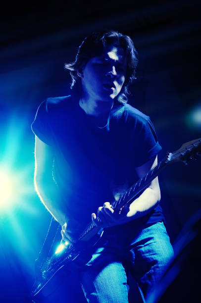 istock Young man plays electric guitar 1319483287