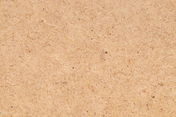 istock Fiberboard or fibreboard, wood chippings board as background. HDF wood panel. 1319483352