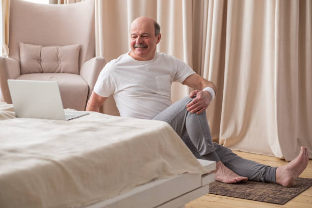 istock Senior caucasian man doing yoga Spine twisting pose 1319484551