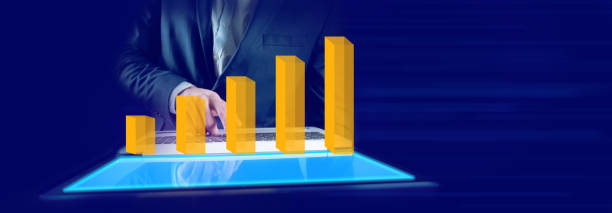 istock Hands of businessman holding computer and business graphs 1319485875