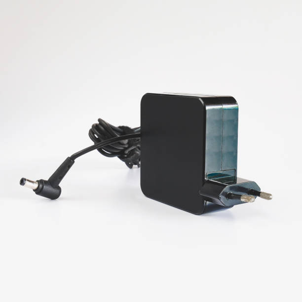 istock Black power ac to dc adaptor. Power adapter of computer on background. 1319488967