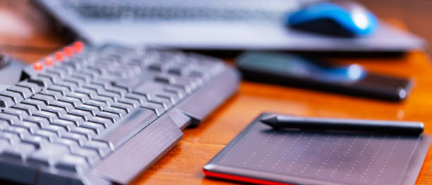 istock Remote work graphic designer. Freelancer workplace. Laptop, smartphone and graphic tablet in the workplace 1319493700