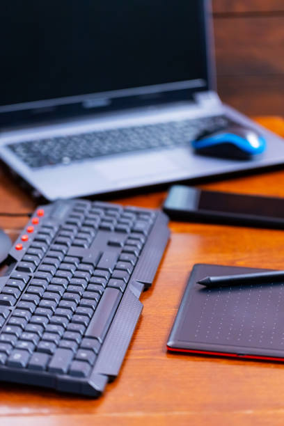 istock Remote work graphic designer. Freelancer workplace. Laptop, smartphone and graphic tablet in the workplace 1319493716