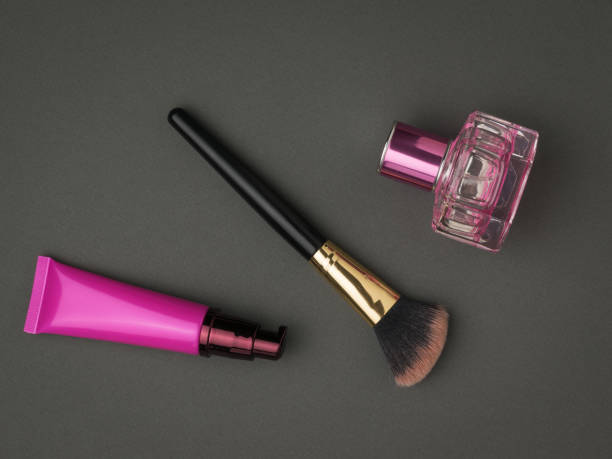 istock A set of bright cosmetics on a dark gray background. 1319493948