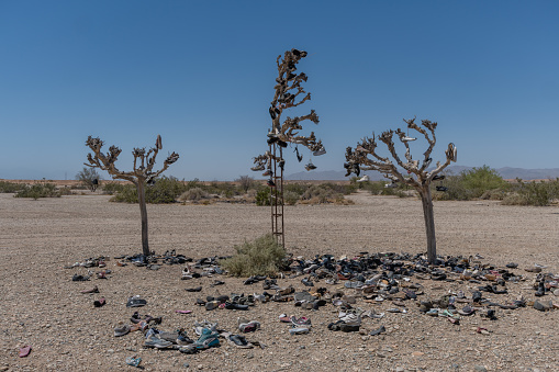 East Jesus, California, USA - May 11th 2021: Shoe Trees in Slab City near Salton Sea, Southern California