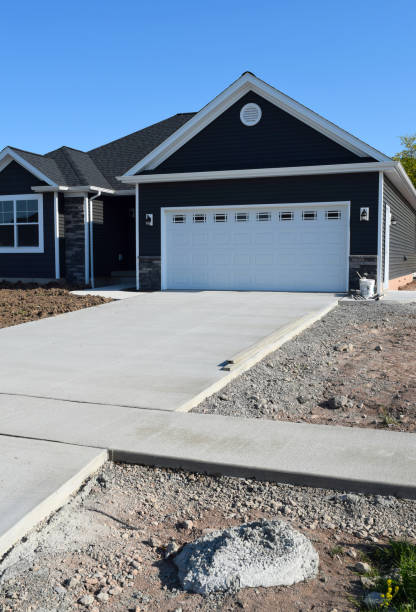 istock New Home Driveway Construction with a Concrete Cement Foundation by Builders for a Smooth Surface 1319497230
