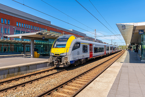 Adelaide, Australia - May 18, 2022: Adelaide Metro electric train on electrified Gawler Line departs Mawson Lakes Station bound for Gawler Central. Test train for new 25kV overhead wiring system and upgraded signalling systems.