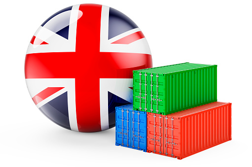 Cargo containers with British flag. Freight shipping in the Great Britain, 3D rendering isolated on white background