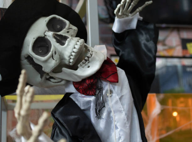 istock funny helloween skeleton with hat and tie 1319503806