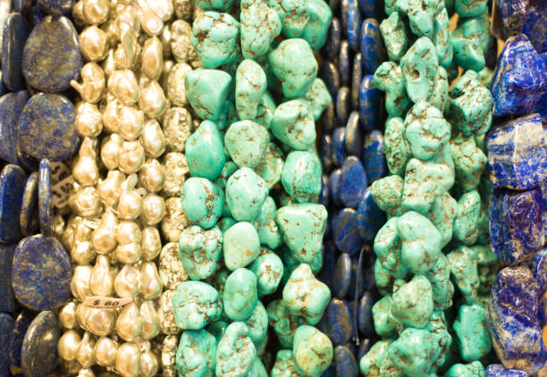 istock Turquoise Beads and Necklaces Hanging (Close-Up) 1319507937