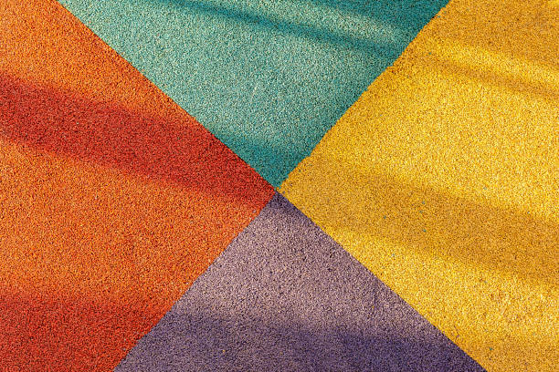 istock Padded floor covering with rubber granules. Special rubber coating for the playground or sports activity. 1319508002