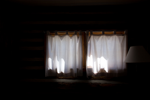 Sunlit Interior Window with White White Curtains