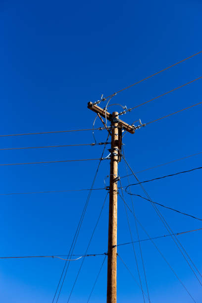 istock Telephone Pole Against VIbrant Blue Sky 1319508216
