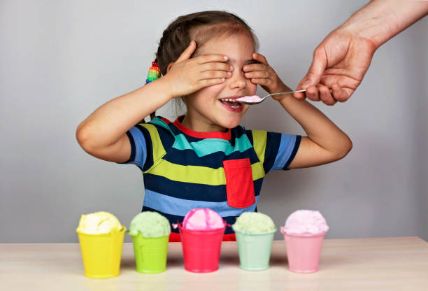 istock Kids eating an ice cream 1319512029
