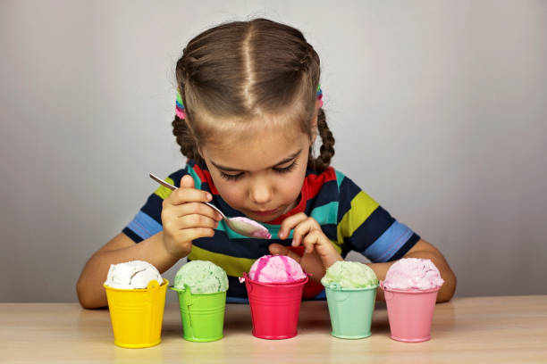 istock Kids eating an ice cream 1319512032