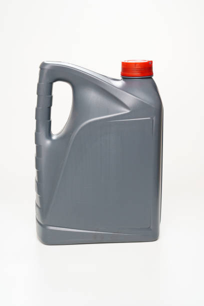 istock grey with a red lid canister with machine oil on a white background. 1319514828