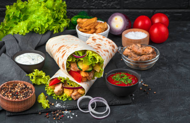 istock Shawarma and ingredients on a black background 1319515297
