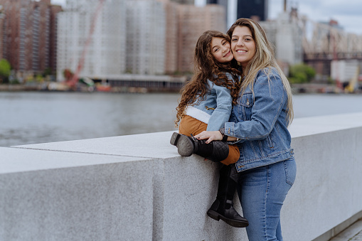 Mother and daughter together outdoors in New York