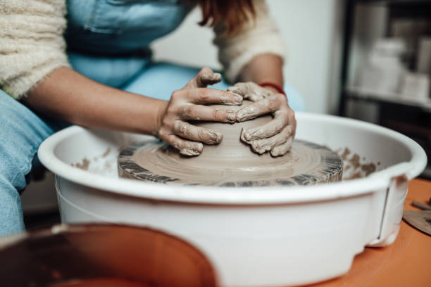 istock Female potter hands close up 1319515899