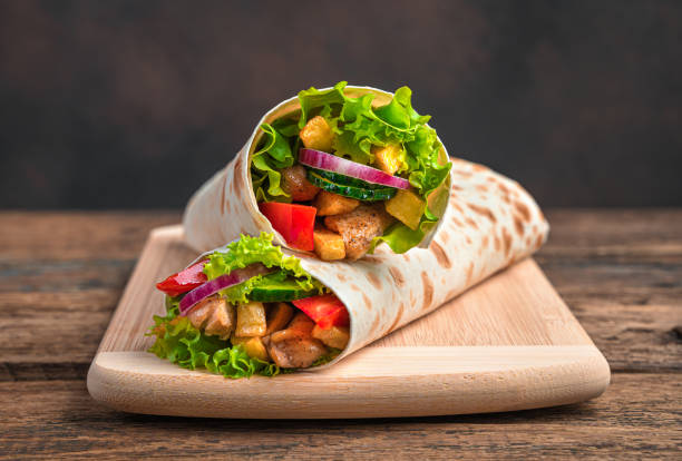 istock Traditional oriental shawarma close-up on a brown background 1319516151