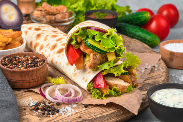 istock Shawarma close-up on a gray background with ingredients. Fast food 1319516902