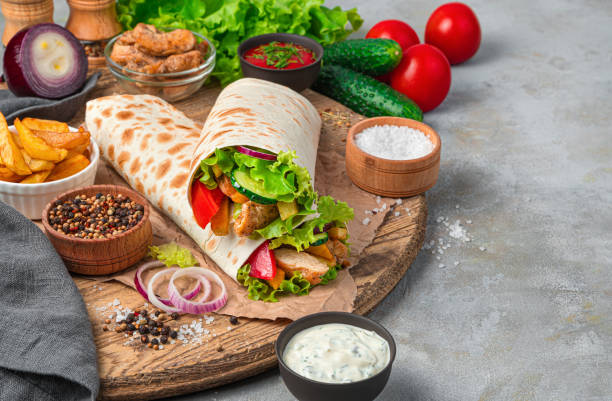 istock Shawarma and ingredients on a gray background with space to copy 1319517149