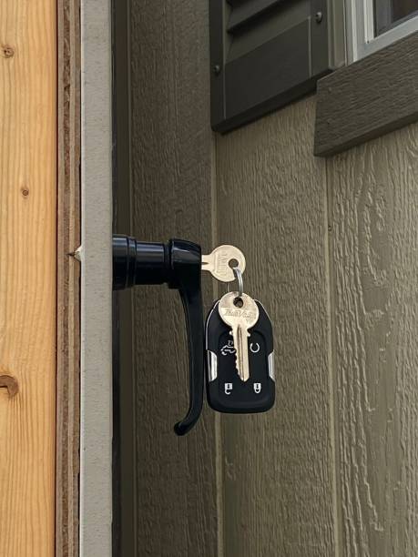 istock Key Hanging in a Shed Door 1319520279