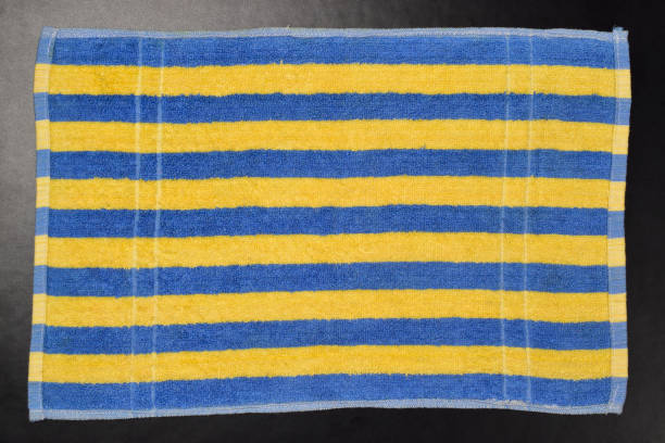 istock Towel Isolated On Black Background, Striped Cotton Towel 1319527714