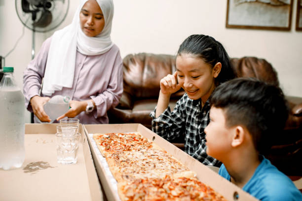 istock dinner party at home with pizza 1319535759