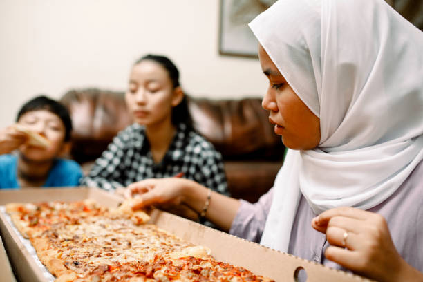 istock dinner party at home with pizza 1319535763
